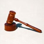 a wooden gavel on a smooth surface