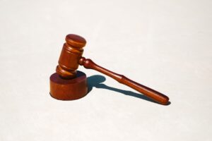 a wooden gavel on a smooth surface